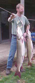 Ohio taxidermist Dan Jennings with a couple of muskies.